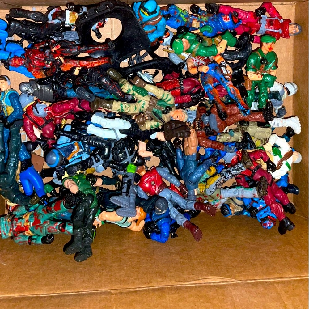 Shoebox full of play soldiers and their gear